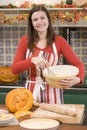 Woman in kitchen making Halloween treats