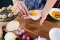 Woman in kitchen. Making traditional Asian steam dumplings with