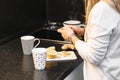 Woman in kitchen slicing lemon to make some tea Royalty Free Stock Photo