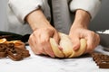 Woman kneading dough for cookies at white marble table, closeup Royalty Free Stock Photo