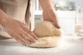 Woman kneading dough for pastry