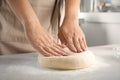 Woman kneading dough for pastry