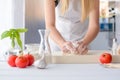 Woman kneading pizza dough on wooden pastry board Royalty Free Stock Photo