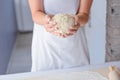 Woman kneading pizza dough on wooden pastry board Royalty Free Stock Photo