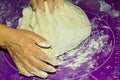 a woman kneading sticky dough into a lump Royalty Free Stock Photo