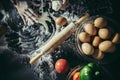 Woman kneads dough for make pizza on wooden.