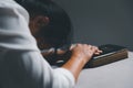 woman kneeling and praying in modern house at sunset time. Female catholic prayer worship to God wish a better life in home at Royalty Free Stock Photo