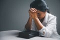 woman kneeling and praying in modern house at sunset time. Female catholic prayer worship to God wish a better life in home at Royalty Free Stock Photo