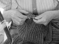 woman knit with knitting needles