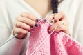 Woman knits woolen clothes Royalty Free Stock Photo