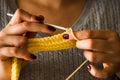 The woman knits woolen clothes. Knitting needles Royalty Free Stock Photo