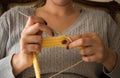 The woman knits woolen clothes. Knitting needles Royalty Free Stock Photo