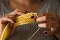 The woman knits woolen clothes. Knitting needles Royalty Free Stock Photo