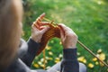 Woman knitting scarf with wool Royalty Free Stock Photo