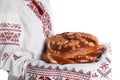 Woman with korovai on white background, closeup. Ukrainian bread and salt welcoming tradition