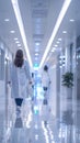 Woman in Lab Coat Walking Down Hallway Royalty Free Stock Photo