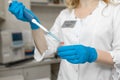 Woman lab technician take blood sample from test tube Royalty Free Stock Photo