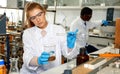 Woman lab technicians in glasses working with reagents and test tubes Royalty Free Stock Photo