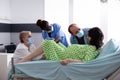 Woman with labor contractions giving birth to baby Royalty Free Stock Photo