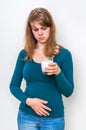 Woman with lactose problem is suffering from stomach pain Royalty Free Stock Photo