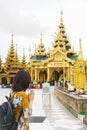 Woman lady tourist pray at shwedagon pagoda temple, Myanmar