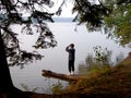 Woman beside lake