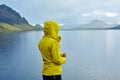 Woman on the Lake coast with mountain reflection, Iceland Royalty Free Stock Photo