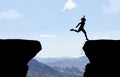 Woman landing after jump over abyss. Royalty Free Stock Photo