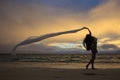 Woman on lanikai beach at sunrise