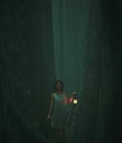 Woman with lantern walking in to the heart of the forest Royalty Free Stock Photo