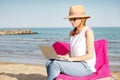 Woman with laptop on the beach Royalty Free Stock Photo