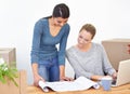 Woman, laptop and boxes for moving into office for small business, start up and paper for designing. Female Royalty Free Stock Photo