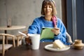 Woman with laptop at coffee shop