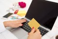 Woman with laptop computer and credit card Royalty Free Stock Photo