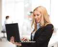 Woman with laptop computer in office Royalty Free Stock Photo