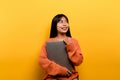 woman and laptop and are happy to work Photo of a beautiful Asian woman who is happy working at home. using a laptop Royalty Free Stock Photo