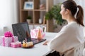 woman with laptop having virtual birthday party