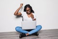 Afro american Woman with laptop on isolated white background. Work anywhere, success, freedom concept Royalty Free Stock Photo