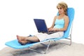 Woman On Laptop In Lounge Chair
