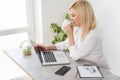 woman laptop online against white wall background