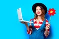 Woman with laptop and pinwheel Royalty Free Stock Photo