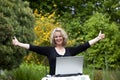 Woman with laptop posing both thumbs up Royalty Free Stock Photo