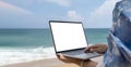 Woman laptop sea. Working remotely on seashore. Happy successful woman female freelancer in straw hat working on laptop Royalty Free Stock Photo