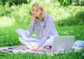 Woman with laptop sit grass meadow. Business lady freelance work outdoors. Freelance career concept. Guide starting