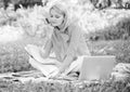 Woman with laptop sit grass meadow. Business lady freelance work outdoors. Freelance career concept. Guide starting