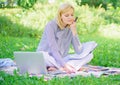 Woman with laptop sit grass meadow. Business lady freelance work outdoors. Freelance career concept. Guide starting