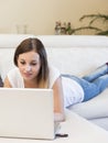 Woman laptop sofa Royalty Free Stock Photo