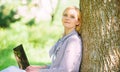 Woman with laptop work outdoors lean tree. Minute for relax. Girl work with laptop in park sit on grass. Education Royalty Free Stock Photo