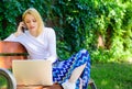 Woman with laptop works outdoor green nature background. Remote jobs browse top freelance remote work opportunities Royalty Free Stock Photo