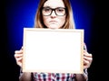 Woman with nerd glasses holding empty frame, copyspace Royalty Free Stock Photo